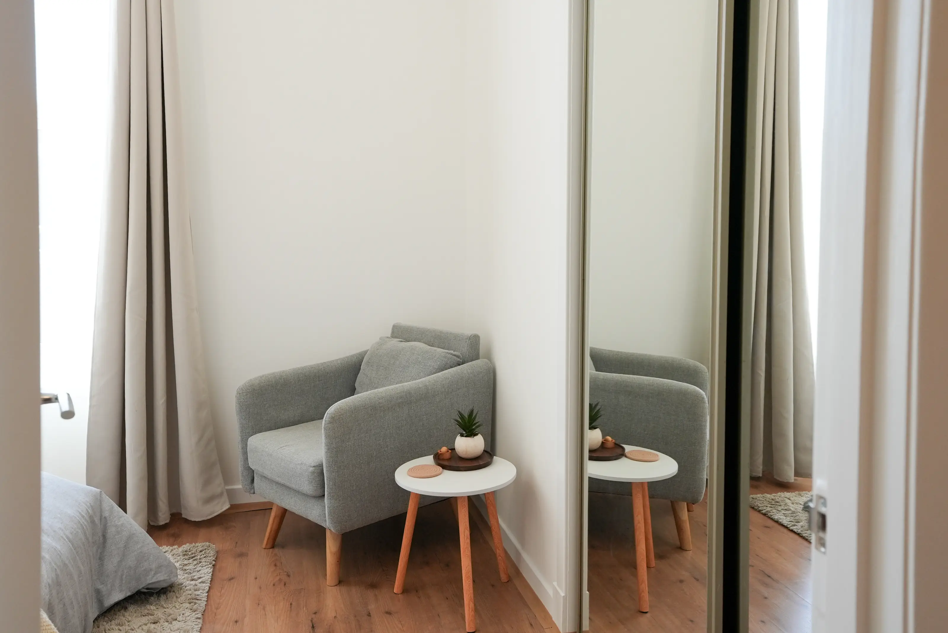 Bright bedroom with natural light and workspace area