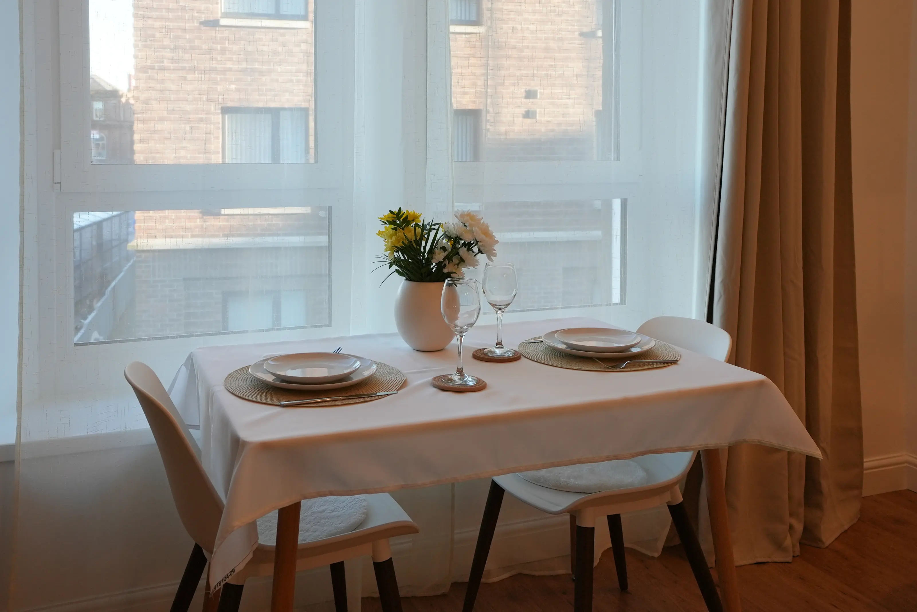 Dining table with seating for four in bright lounge area